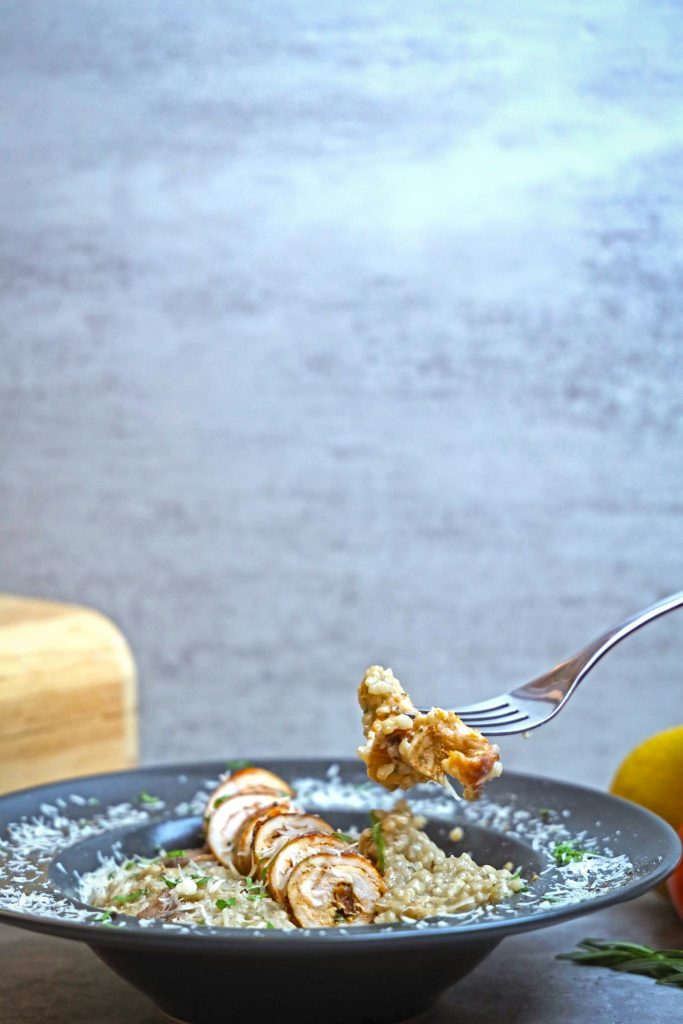 A plate of food with a fork and knife