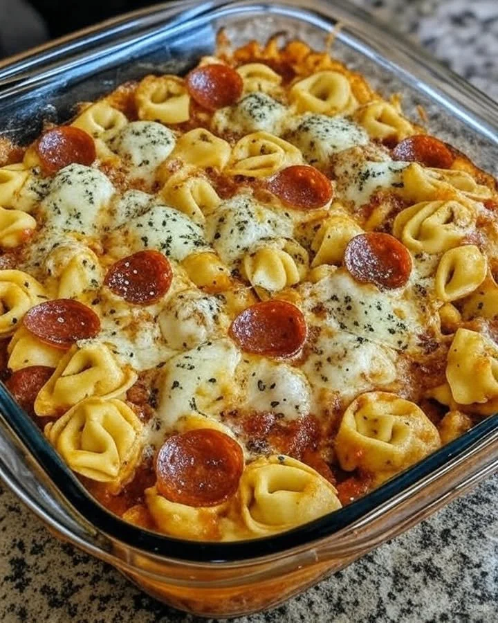Cheese tortellini pizza casserole with pepperoni and melted cheese