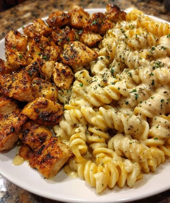 Cheesy Cajun Chicken Twisted Pasta in Italian Herb Alfredo Sauce