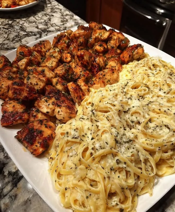 Delicious Garlic Herb Chicken served with Fettuccine Alfredo, a flavorful dish