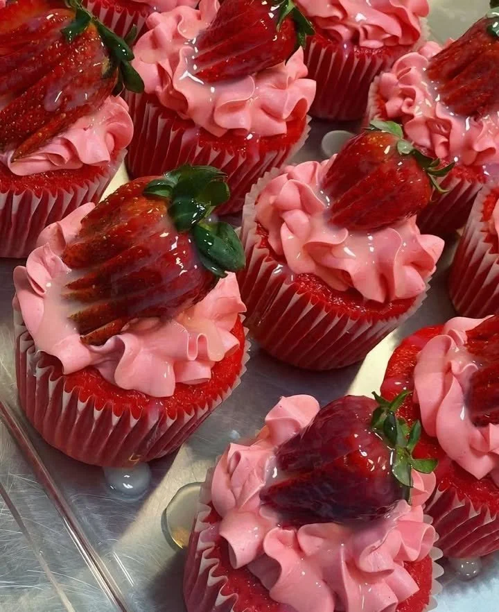Deliciously frosted cupcakes in a variety of flavors and colors.
