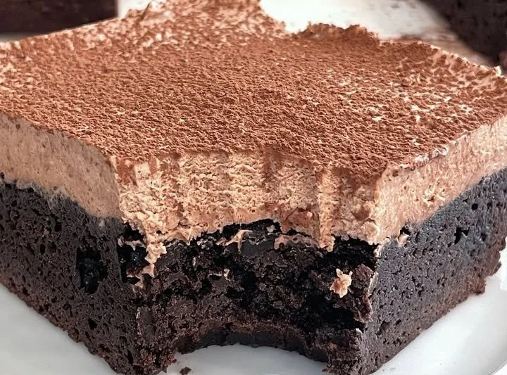 Delicious chocolate mousse brownies topped with creamy chocolate ganache.
