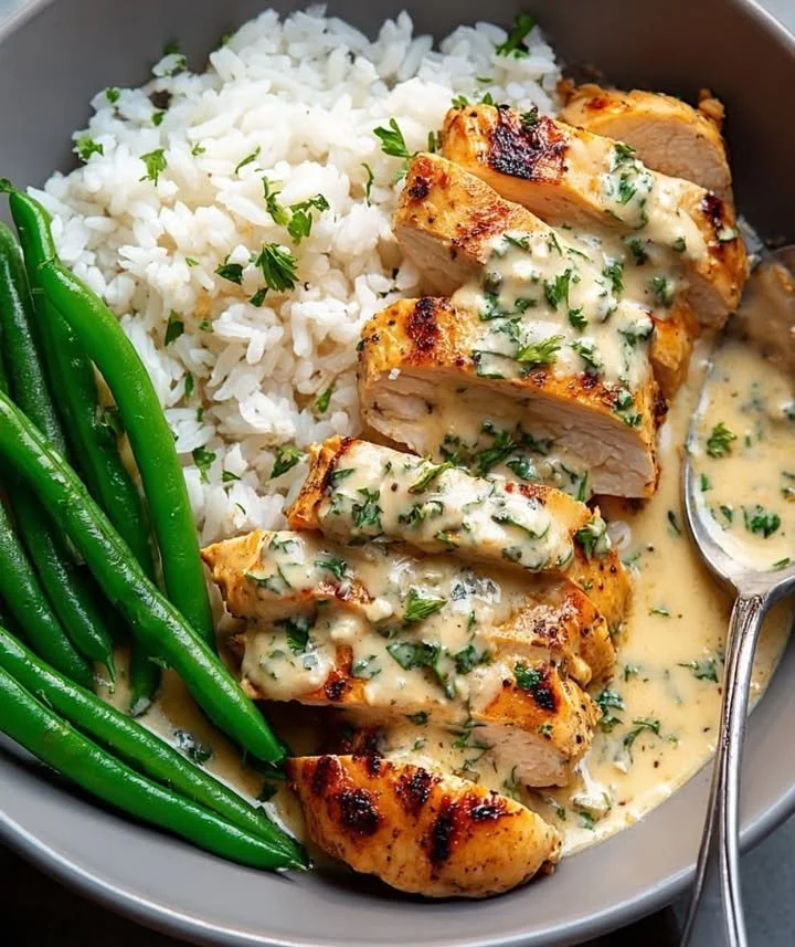 Creamy Garlic Herb Chicken served with fresh herbs and spices for a delicious meal
