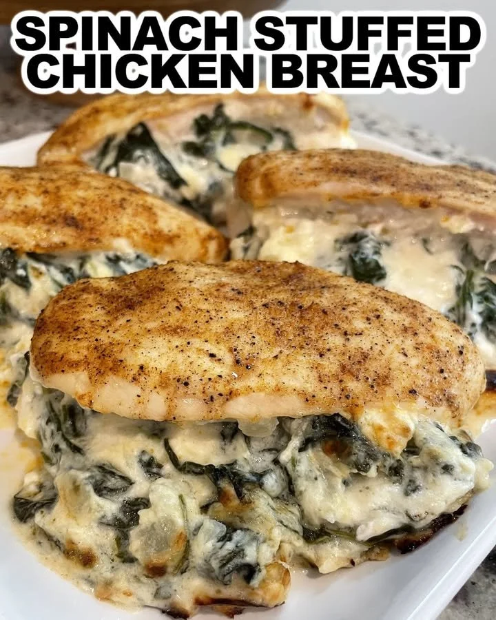 Delicious spinach stuffed chicken breast served on a plate with vegetables