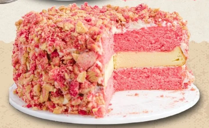 Strawberry Shortcake Cheesecake topped with fresh strawberries and whipped cream
