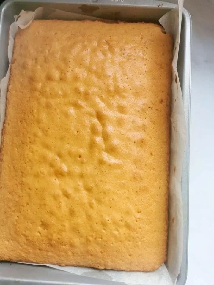 Delicious vanilla sheet cake topped with creamy frosting