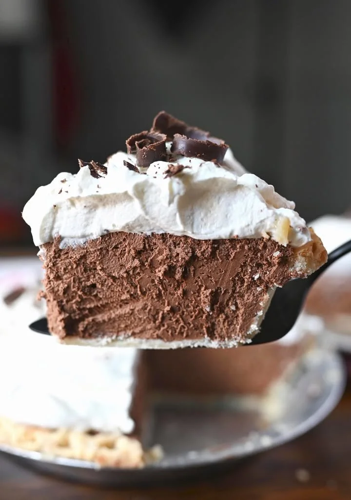 Delicious chocolate cream pie with whipped cream topping