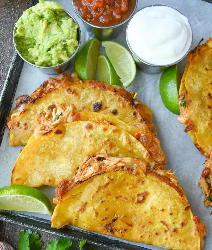 Delicious crispy chicken tacos with fresh garnishes and toppings