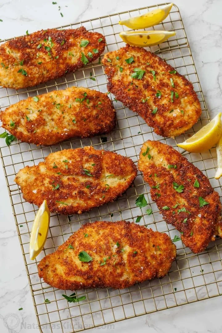 crispy Italian chicken cutlets served with fresh herbs