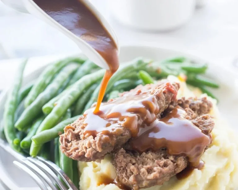 Delicious Keto Meatloaf served on a plate with herbs