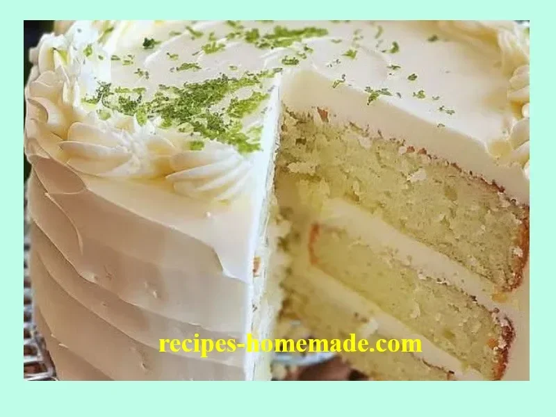 Slice of Key Lime Cake with Key Lime Cream Cheese Frosting on a plate