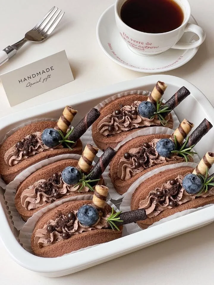 Mini chocolate roll cake with blueberries and wafer layers