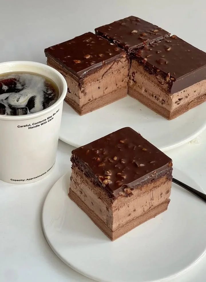 No-bake chocolate hazelnut mousse cake bars topped with chocolate and hazelnuts