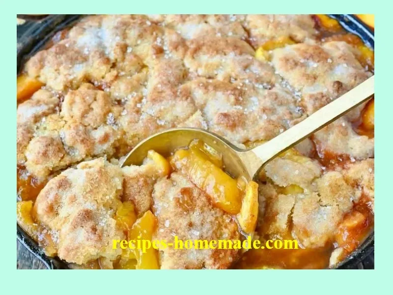 Delicious homemade Peach Cobbler served in a baking dish with a golden crust.