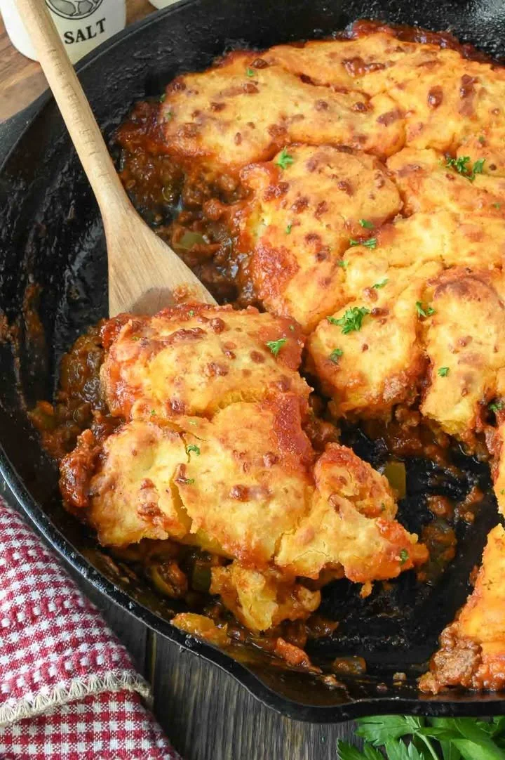Delicious Sloppy Joe Casserole topped with cheese and served in a baking dish.