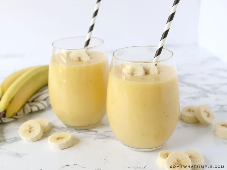 Tropical banana smoothie with fresh fruits and a creamy texture in a glass