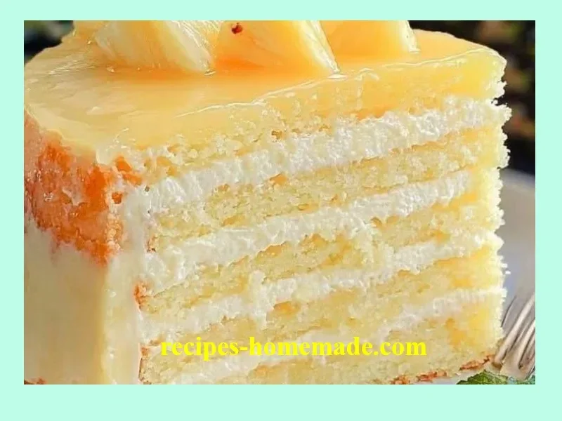 Tropical Pineapple Bliss Cake adorned with fresh pineapple and cream frosting