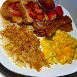 Delicious buttery strawberry pound pancakes topped with fresh strawberries
