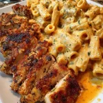 Cajun Chicken Rigatoni served in creamy mozzarella garlic Alfredo sauce