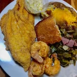 Delicious Catfish & Shrimp dish served with flavorful garnishes
