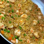 Chopped Shrimp Fried Rice garnished with fresh vegetables and herbs