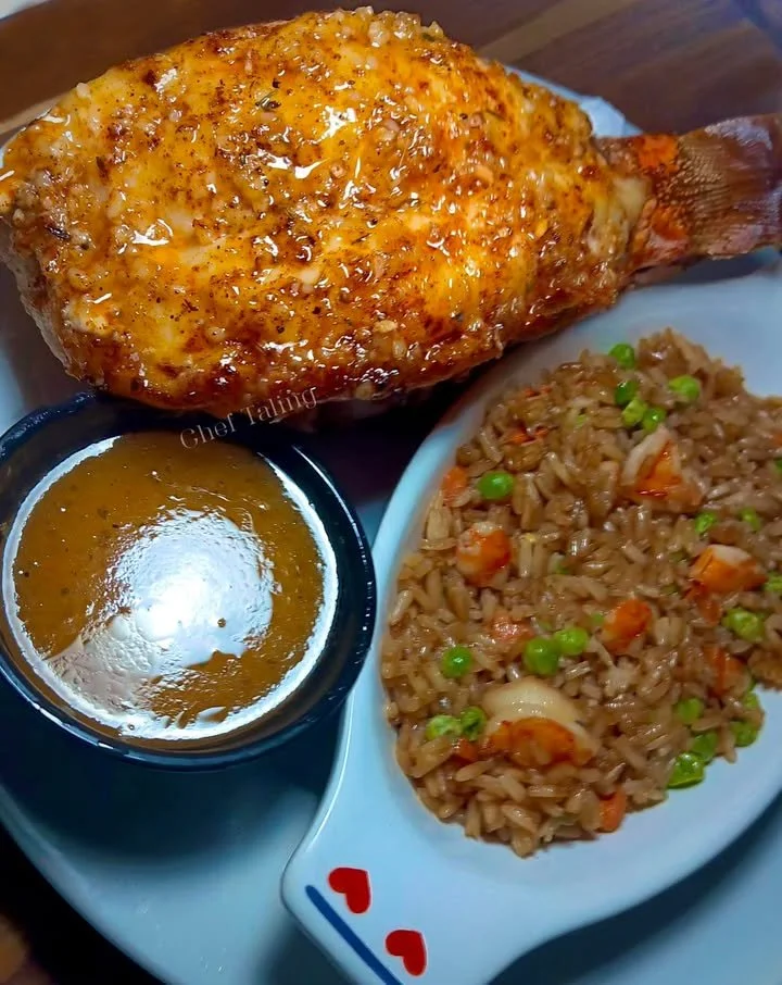 Cowboy Butter Broiled Lobster Tail served with Shrimp Fried Rice