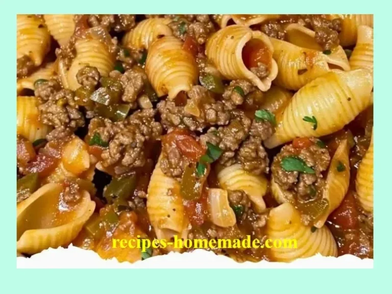 Creamy beef and shells dish served in a bowl with herbs and cheese