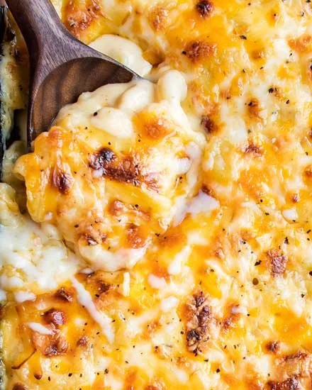 Creamy macaroni and cheese in a bowl with melted cheese on top