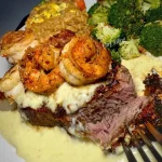 Juicy Filet Mignon topped with creamy Garlic Parmesan Cream Cheese Sauce