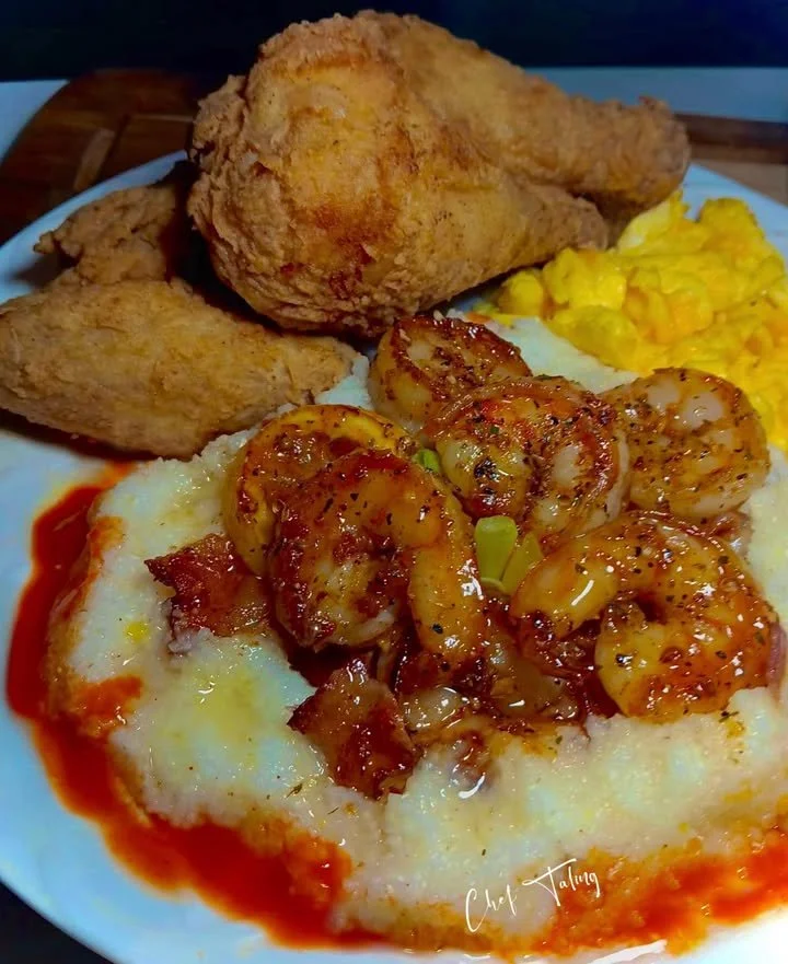Plate of crispy fried chicken with shrimp and honey butter grits
