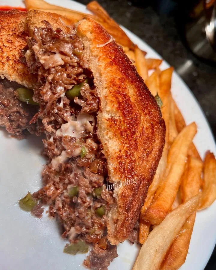 Grilled cheesesteak with sirloin, bell peppers, and melted mozzarella cheese