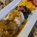 Delicious hamburger steak served with rich mushroom gravy on a plate