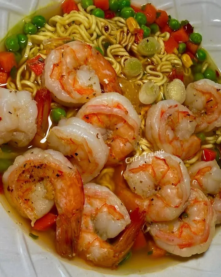 Bowl of homemade shrimp ramen with fresh ingredients and vibrant colors