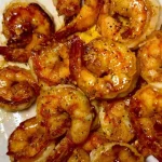 Delicious honey garlic butter ginger shrimp served on a plate