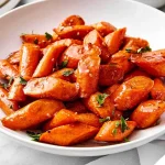 Delicious honey glazed carrots served as a colorful side dish