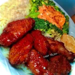 Honey hot wings served with buttered white rice and steamed broccoli