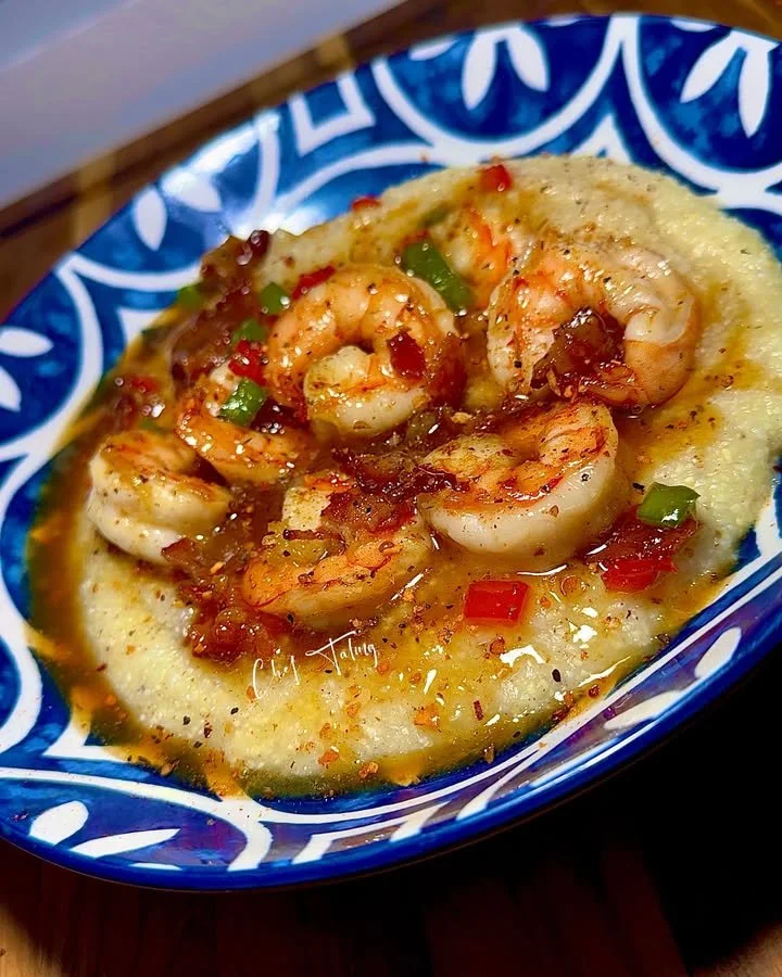 Lite Cowboy Butter Shrimp served with creamy grits on a plate