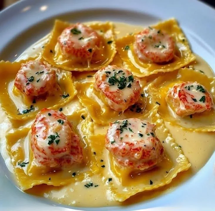 Lobster ravioli served with creamy tomato vodka sauce on a plate.