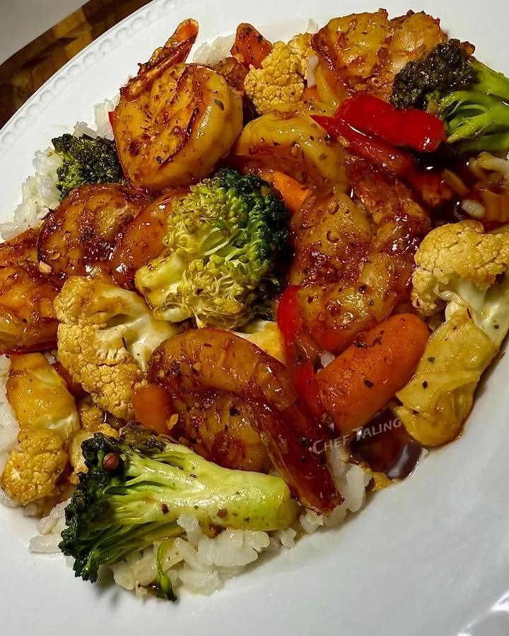 Delicious Mandarin shrimp stir fry with vibrant vegetables in a pan.