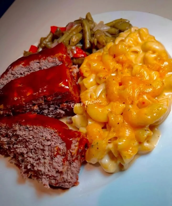 Delicious meatloaf served with quick mac and green beans on a plate