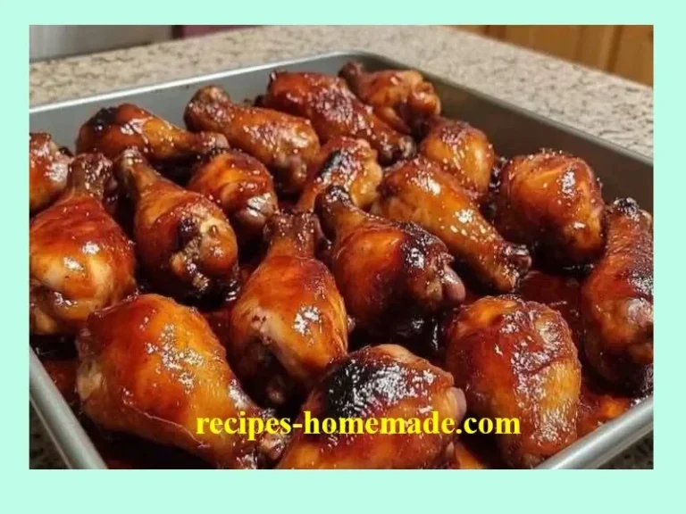 Oven baked BBQ chicken wings garnished with herbs on a serving plate