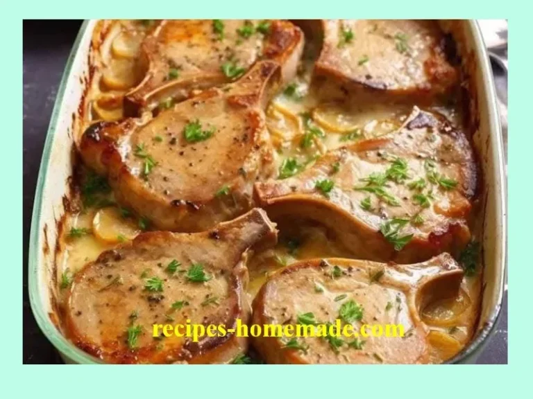 Juicy pork chop served with fluffy baked potatoes on a plate