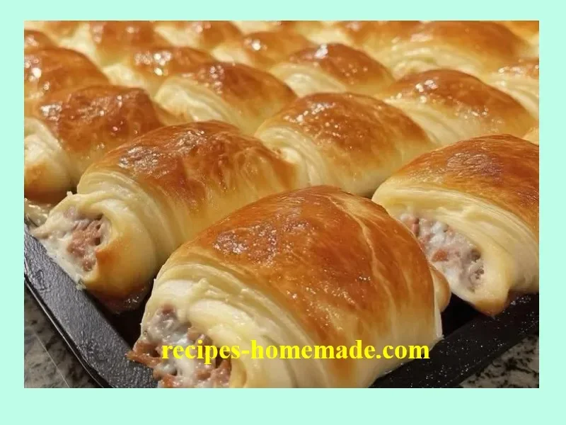 Sausage cream cheese crescent rolls on a serving plate