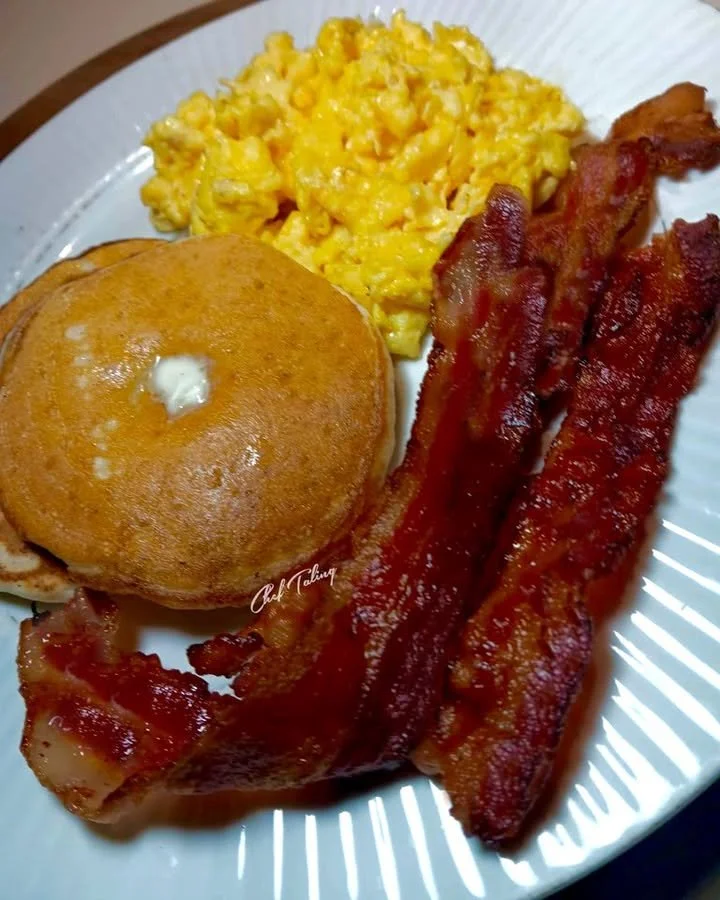 Silver Dollar Pancakes served with bacon and scrambled eggs on a plate