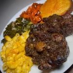 Delicious spicy oxtail dish garnished with herbs and spices