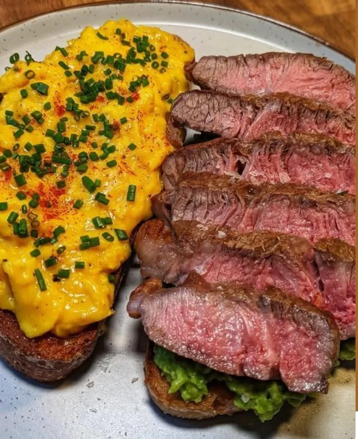 Delicious Steak Cheese Sandwich on toasted rye with egg for breakfast