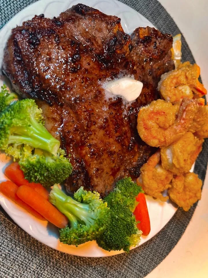 Delicious Steak & Shrimp breakfast platter with eggs and vegetables