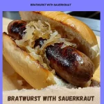 Delicious bratwurst served with sauerkraut on a plate.