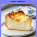 German Cheesecake Slice of German Cheesecake topped with fresh berries on a white plate.