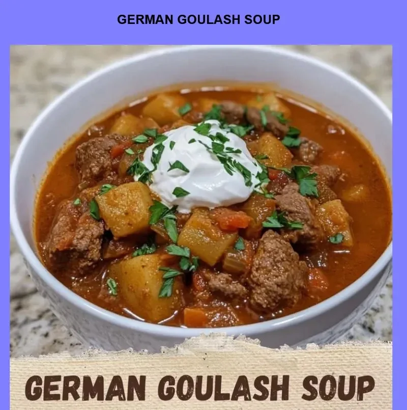 Bowl of German Goulash Soup garnished with fresh herbs and bread